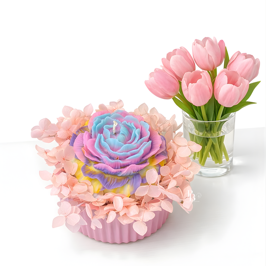 Rainbow rose flower candle in pink ridged holder with pastel petal wrap, plus pink tulip bouquet