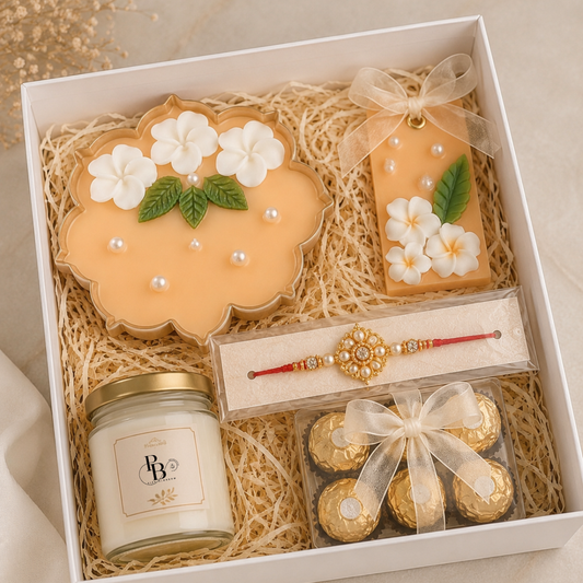 Luxury gift hamper with floral decorative ornament, bracelet, scented jar, and wrapped chocolates