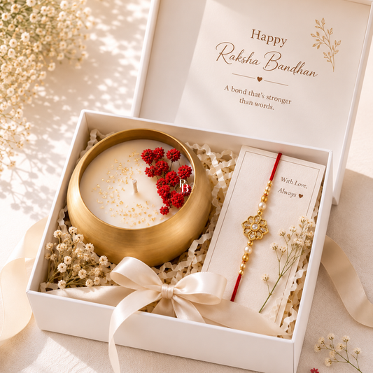 Luxury soy wax candle in gold holder with red floral rakhi in gift box