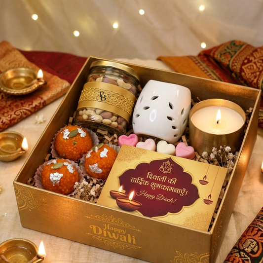 Festive Diwali gift hamper box with candle, sweets, decorative diya and bath accessory