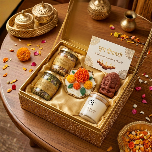 Luxury Diwali gift hamper box with Ganesha idol, spice jars, card, and flowers inside