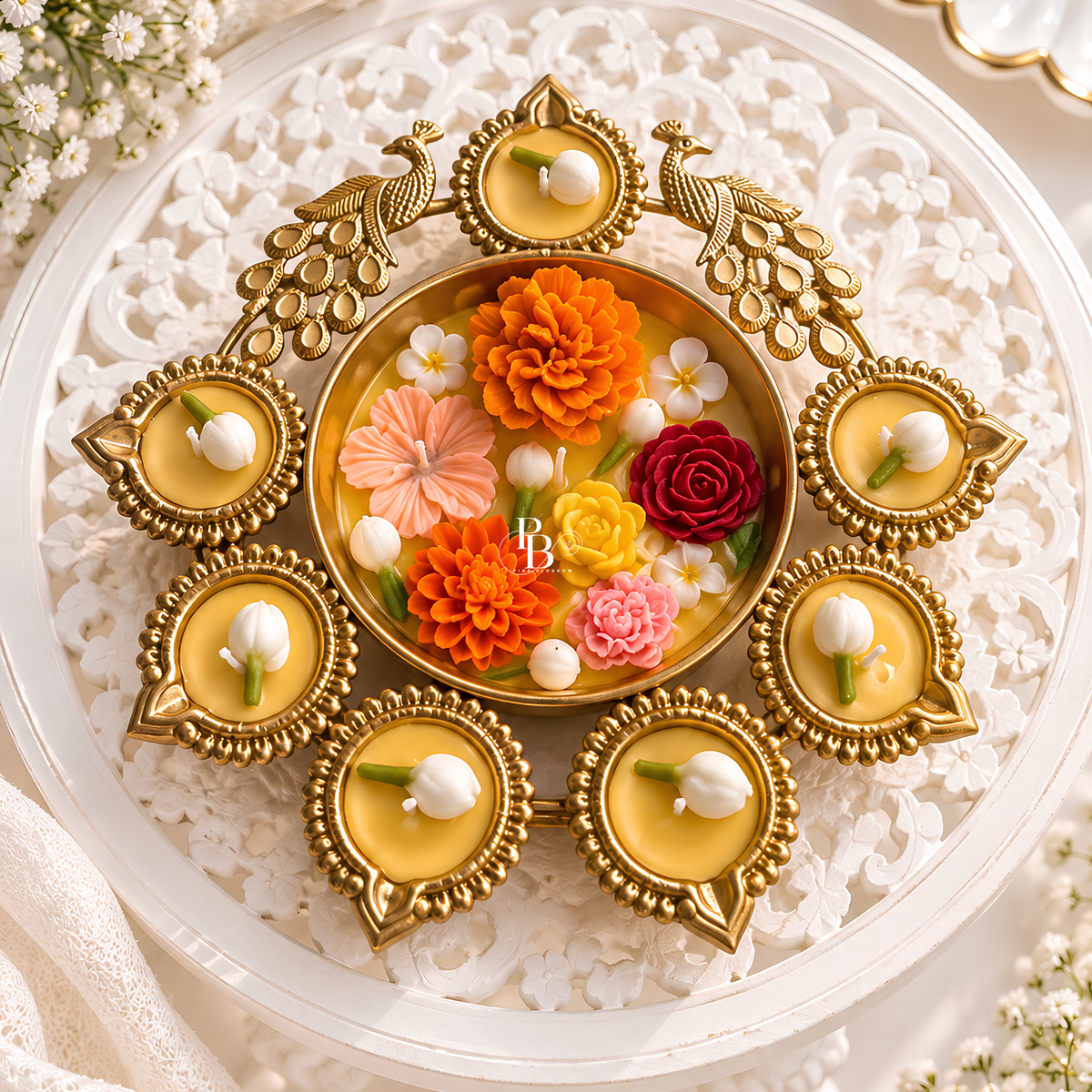 Decorative gold candle tray with five wax cups, white wicks, and floral center
